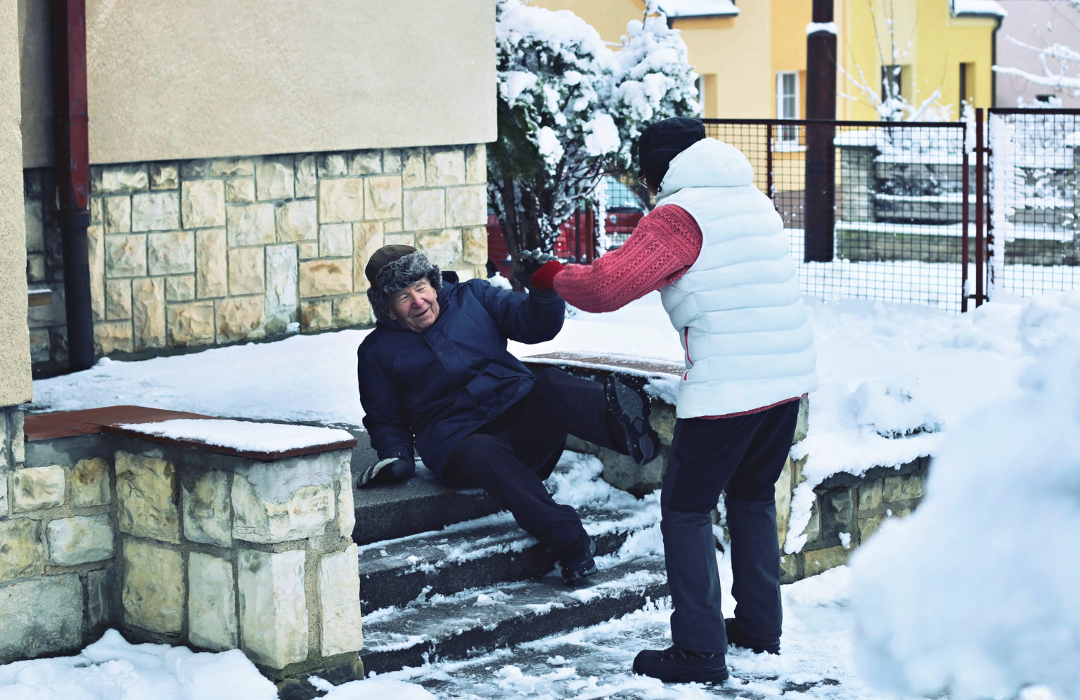 elderly man slipping on icy steps