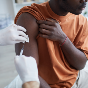 Male receiving COVID-19 vaccine